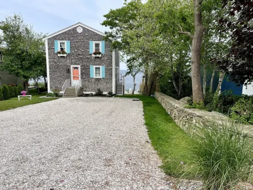 Home with spectacular panoramic ocean views from a bluff high above Cape Cod Bay