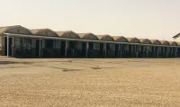 Whispering Sands Motel Hotels near Factory Butte