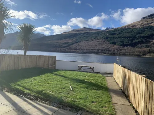 Situated in Lomond Park on the shore of Loch Long with amazing views