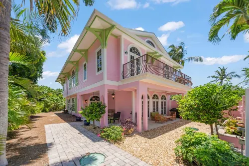 Waterfront Pink House with Private Dock & Pool