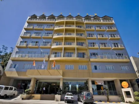 Baguio Burnham Suites Отели рядом с достопримечательностью «Университет Филиппины Багио»