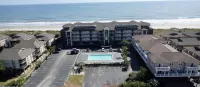 Ocean front 2 bedroom / 2 bathroom condo.  Sleeps 6.  Elevator/pool/grill.