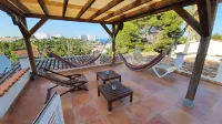 Villa on 2 beautiful bays with sandy beach, heated pool, ideal for. children