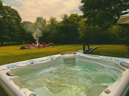 HOT TUB and SAUNA at 'CHIC HIDEAWAY''  Paw Paw Lake Golf club across the street