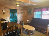 3BR, 1 Bath Cabin with hot tub, full kitchen, and living room.