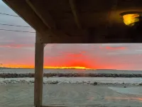 New! 30 seconds from couch to shore, covered front porch w/sunset water views.