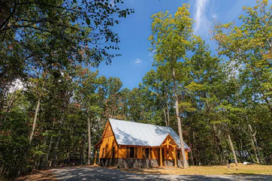 Charming Cabin Retreat with Hot Tub and Outdoor Games - Cozy Escape