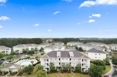 Full Kitchen and Resort Pool Access - Tranquil Oasis Hotels near Barefoot Landing