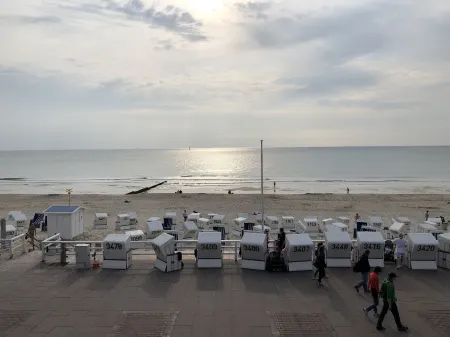 Relax under thatched roof between the seas