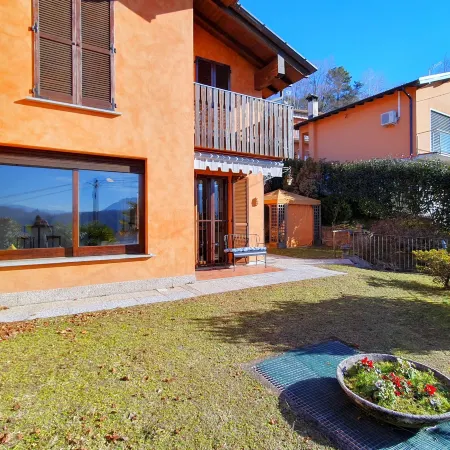 House in Luino with Green Garden and City Views