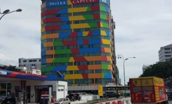 "A building with a sign that says ""hotel"" in front, along with another sign expressing affection" at Hotel Capital Kota Kinabalu