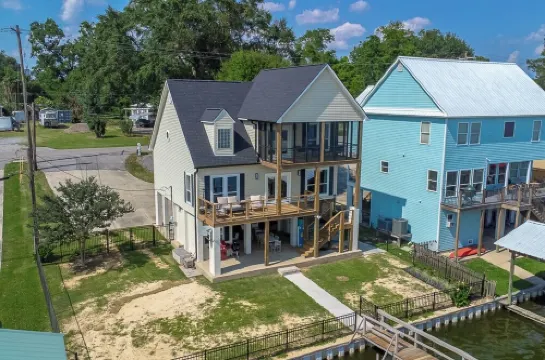 It's About River Time, a 3BR/3BA house on False River, fenced yard & large pier!