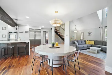 High-end home w/ fireplace, gourmet kitchen, sauna, game rm/ large yard/fire pit