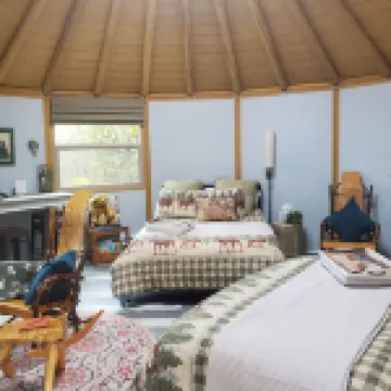 Fanciful mountainside yurt with private bathhouse
