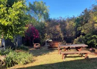 Lillie’s Oceanview RUSTIC Boho Surf Cottage Steps to the beach & fun!