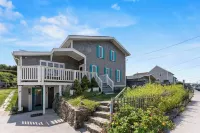 Ocean view spacious 5-bedroom Cape Cod style house with roof deck, AC, WiFi.