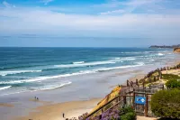 Expansive Oceanfront Patio and Resort-Style Amenities - Charming Coastal Haven