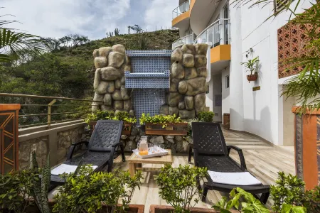 Terrazas Tayrona Travelers Apartamentos y Suites Отели в г. Гайра