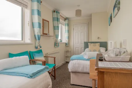 Trevarrian Lodge Отели в г. Мауган-ин-Пайдар