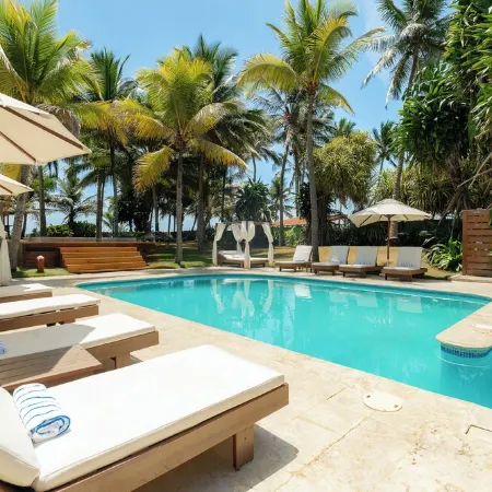 Award-Winning Beachfront VillaSleeps 28  • Full Staff • Pool Spa Private Beach