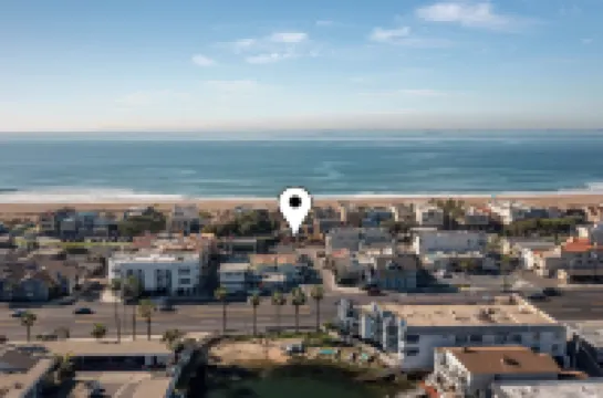 Across quiet street from sandy beach.