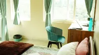 Vasu Inn - Rooms in Valparai - vue sur la montagne