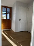 A house with the ocean at the end of the garden
