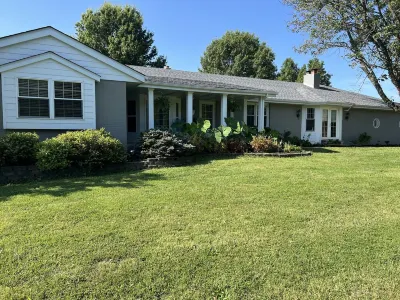 BACKYARD OASIS! Cozy and charming 60s Brick ranch with relaxing gazebo over pond