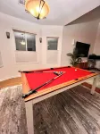 Views of NY Skyline & Statue of Liberty with Pool Table, 5min to train to NYC - Balcony