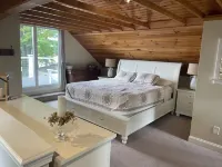 Relax in Raymond's lakefront 2-bedroom vacation home, just steps to Sebago Lake