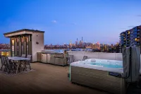Modern Luxury: 4BR Townhome + Den + NYC Views