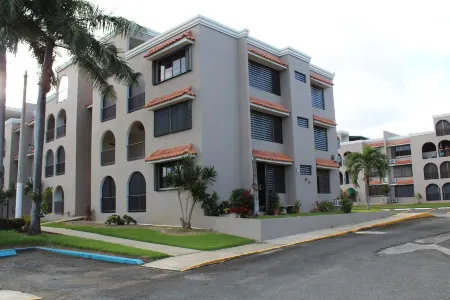 Steps away from a soft sand beach and warm waters