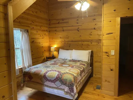 Secluded cozy cabin nestled among the hemlocks and rock formations in Hocking