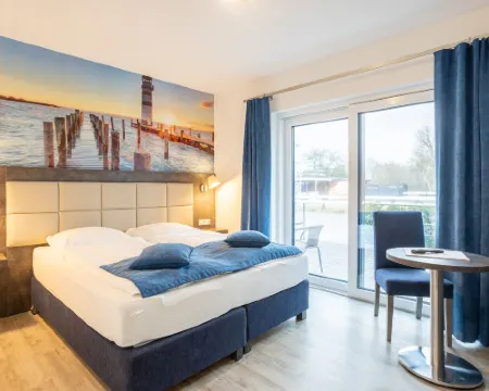 ฟามิเลียนแอนด์อพาร์ทโฮเทล ซตรานด์โฮฟ โรงแรมในTossens