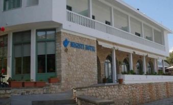 "a building with a sign that reads "" netsy hotel "" on the front , located in a city" at Megisti Hotel