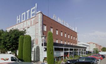 "a large hotel with the words "" hotel art & sky "" prominently displayed on its side" at Hotel America Igualada