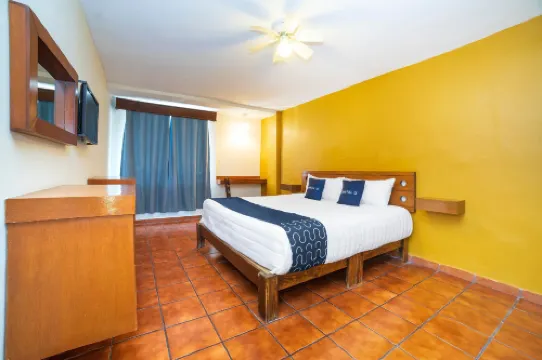 Capital O Hotel Casa Blanca