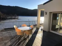 Luxury apartment with terrace on the shores of Lake Chambon overlooking Sancy
