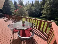 Private mid-century modern hideaway in forest near the river and sea.