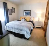 NEW! Renovated Bungalow steps from Lake Tomahawk - King Bed, Dock Space, Firepit