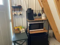 King bed in Tulip Glamping Aframe at Noble Pine Campground