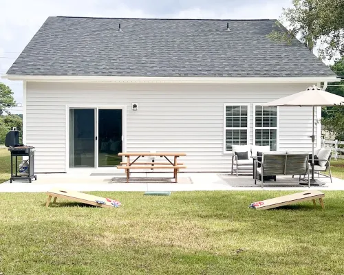 Coastal Retreat 10 Minutes to Beach w/ King Bed, Grill, Fire Pit & Game Room Hotels in Stump Sound