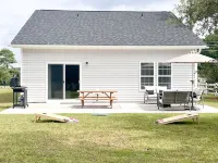 Coastal Retreat 10 Minutes to Beach w/ King Bed, Grill, Fire Pit & Game Room - 4-Star