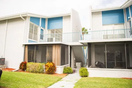 Enjoy sunny water views from your private lanai.  Steps to Madeira Beach.
