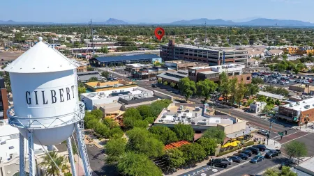 Seaside Cottage in walking distance of downtown Gilbert with charming pool.