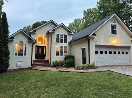 Spectacular Main Lake Sunsets from spacious 4 BR, 3800 sq ft, 1-acre point lot