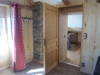 Typical Savoyard chalet with roof shingles, tufa walls and foist