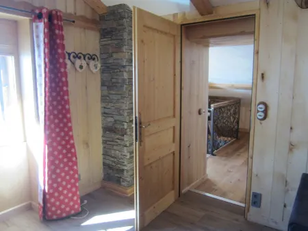 Typical Savoyard chalet with roof shingles, tufa walls and foist