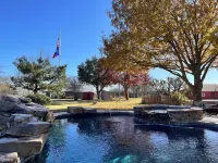 Cozy farmhouse w/pool. Central to museums, golfing, lakes, sports & shopping.
