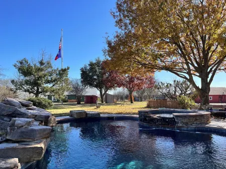 Cozy farmhouse w/pool. Central to museums, golfing, lakes, sports & shopping.